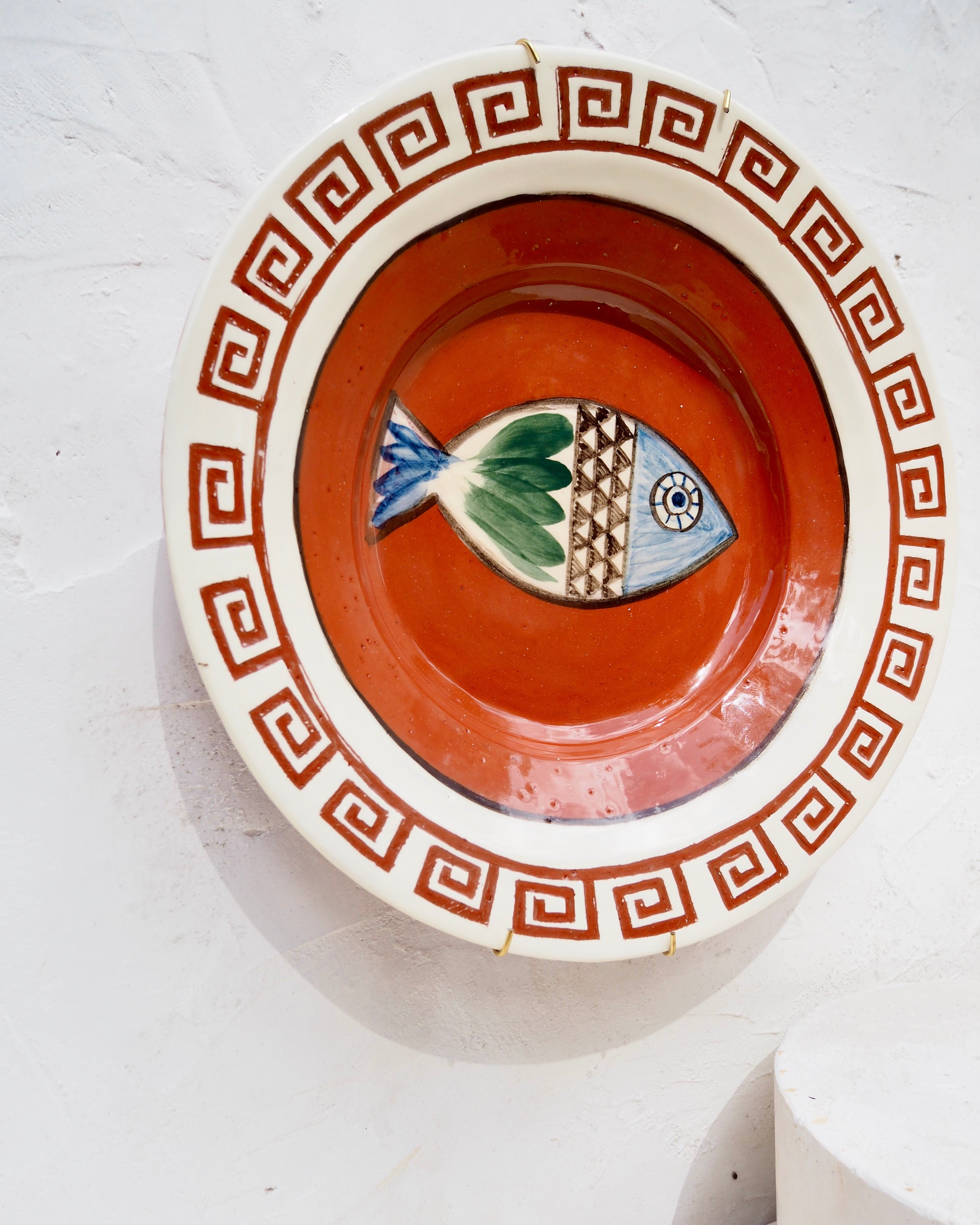 Etruscan Wall Charger - Carved border and fish design with brass wall hook
