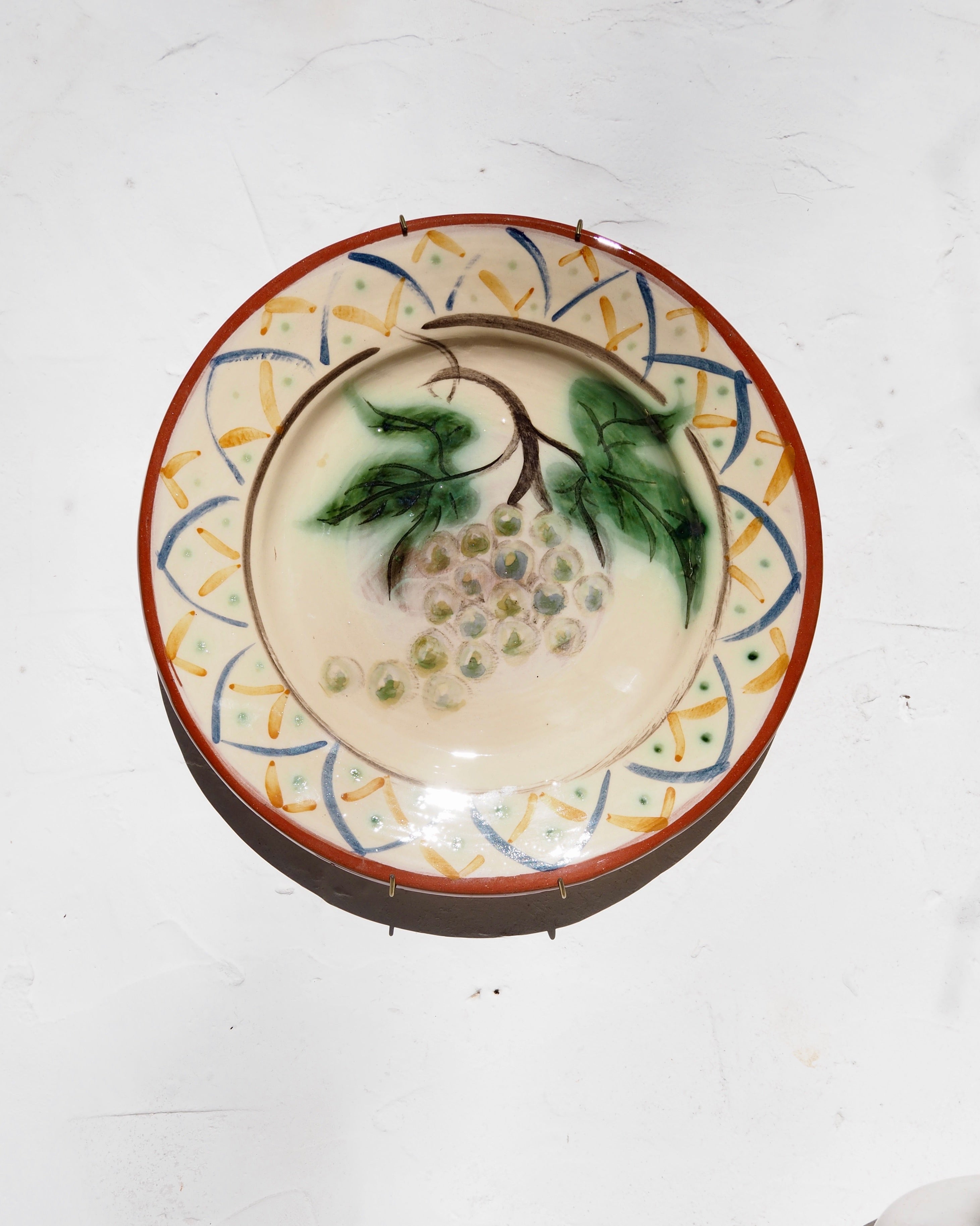 Plate with grape design