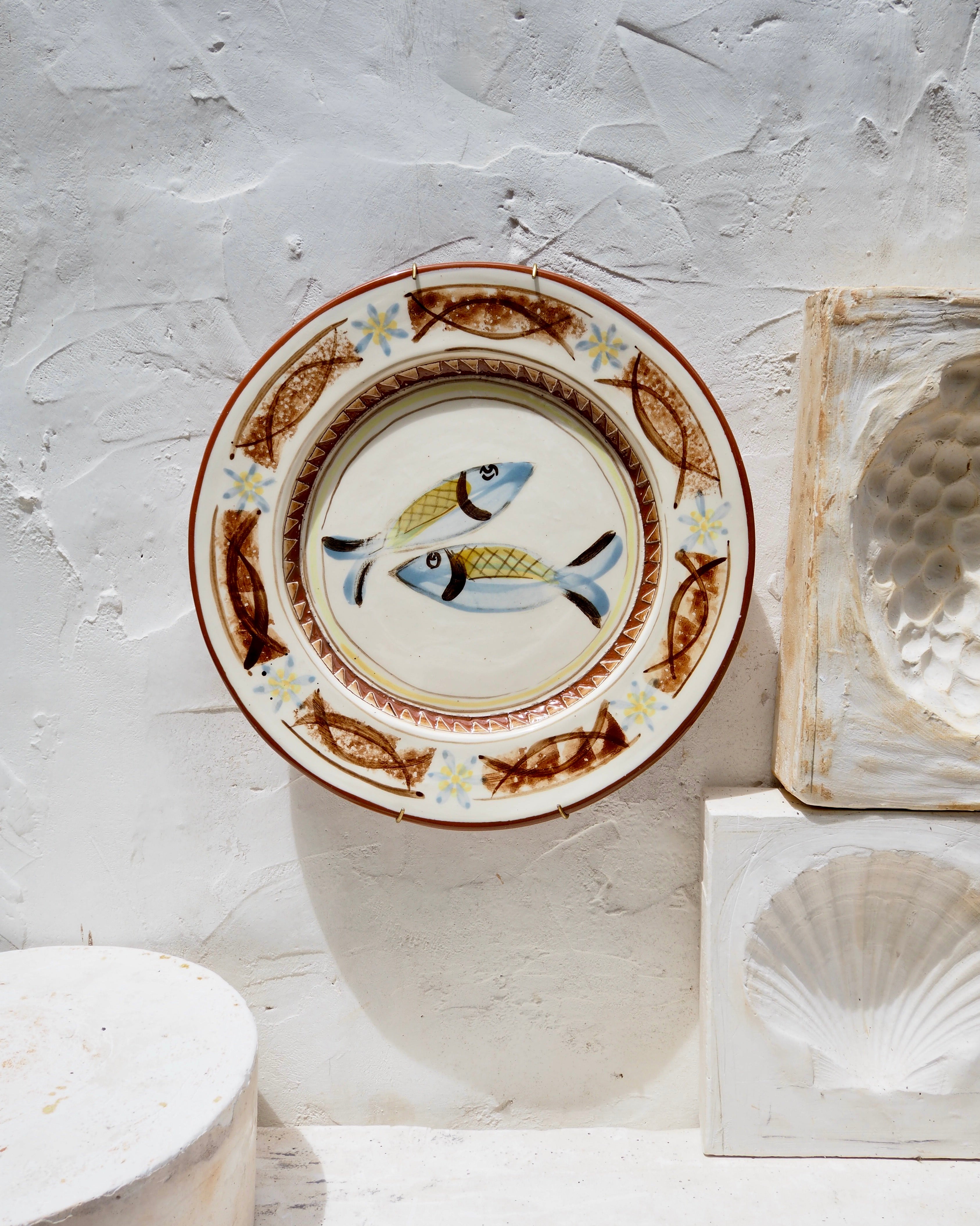 Plate with blue fish with carved details