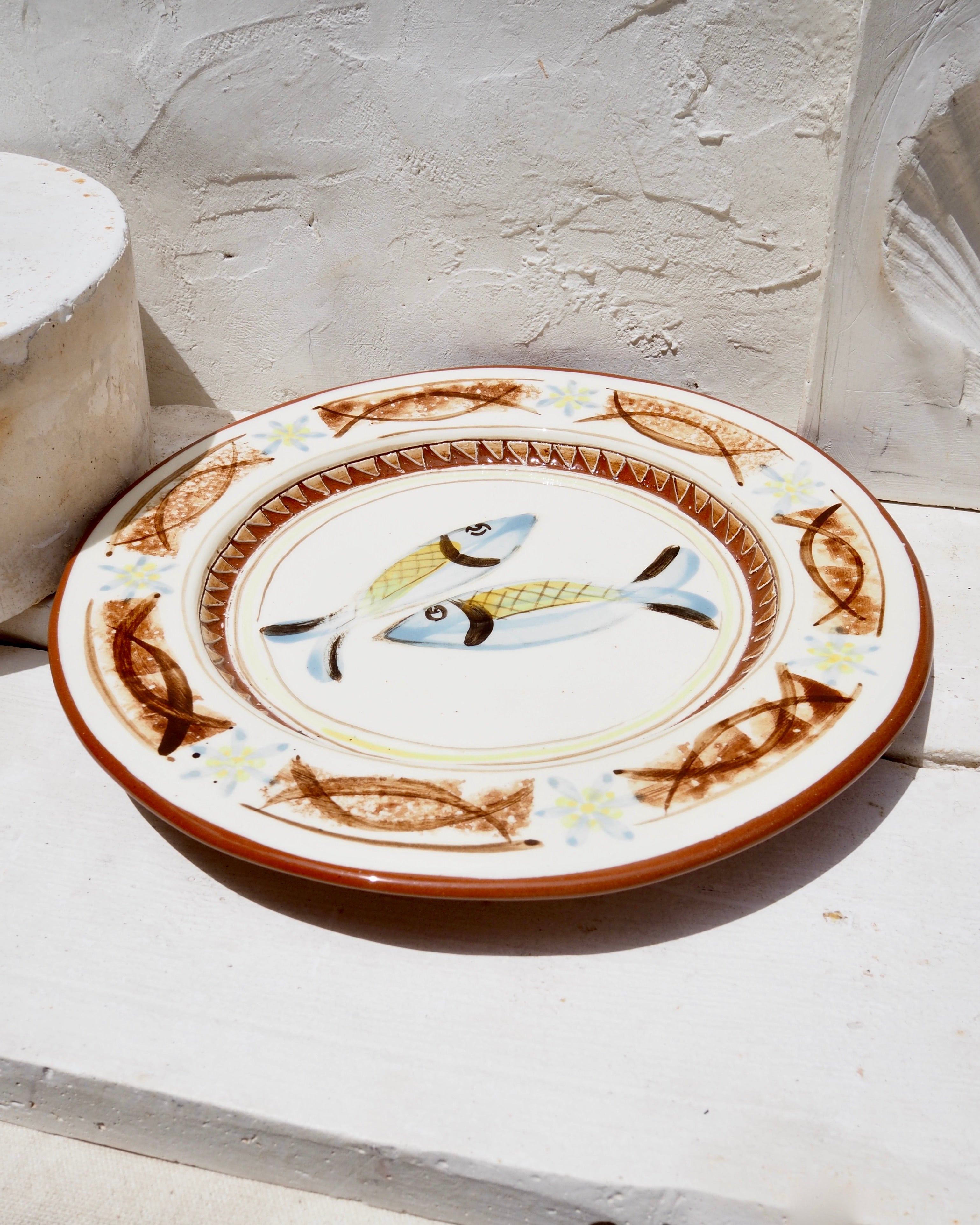Plate with blue fish with carved details
