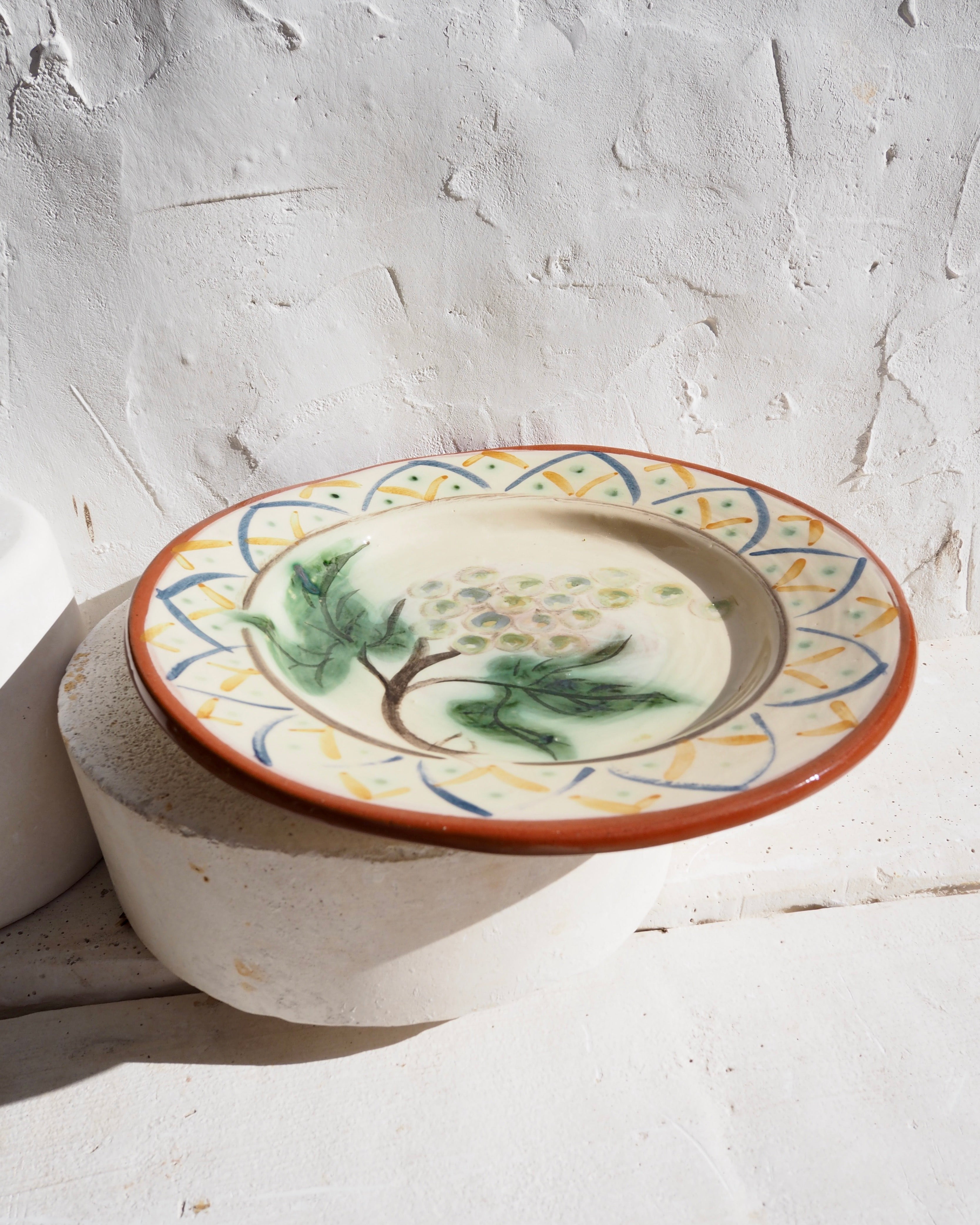 Plate with grape design