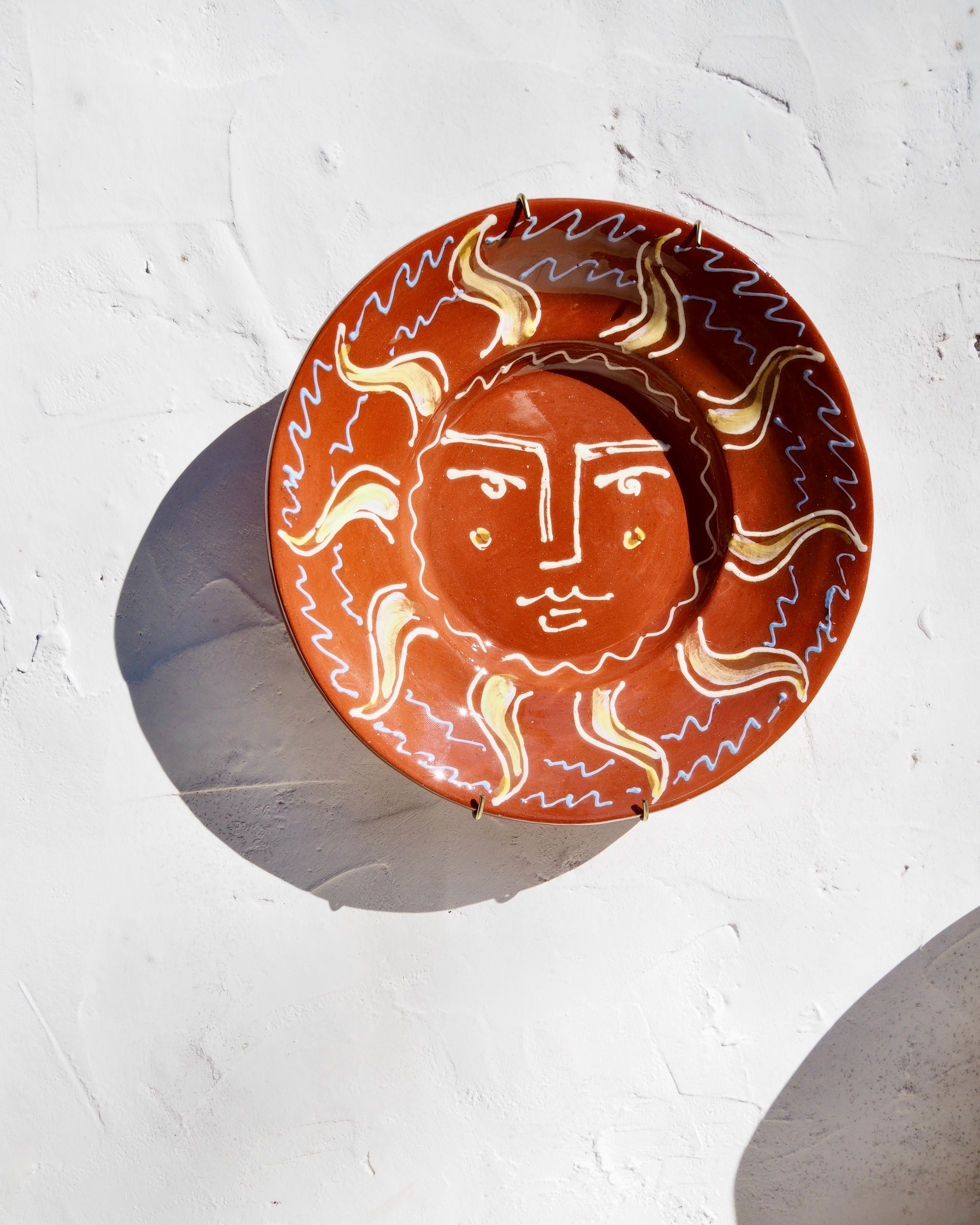 Puglia Plate - Slip trail designed Il sole face with brass wall hook